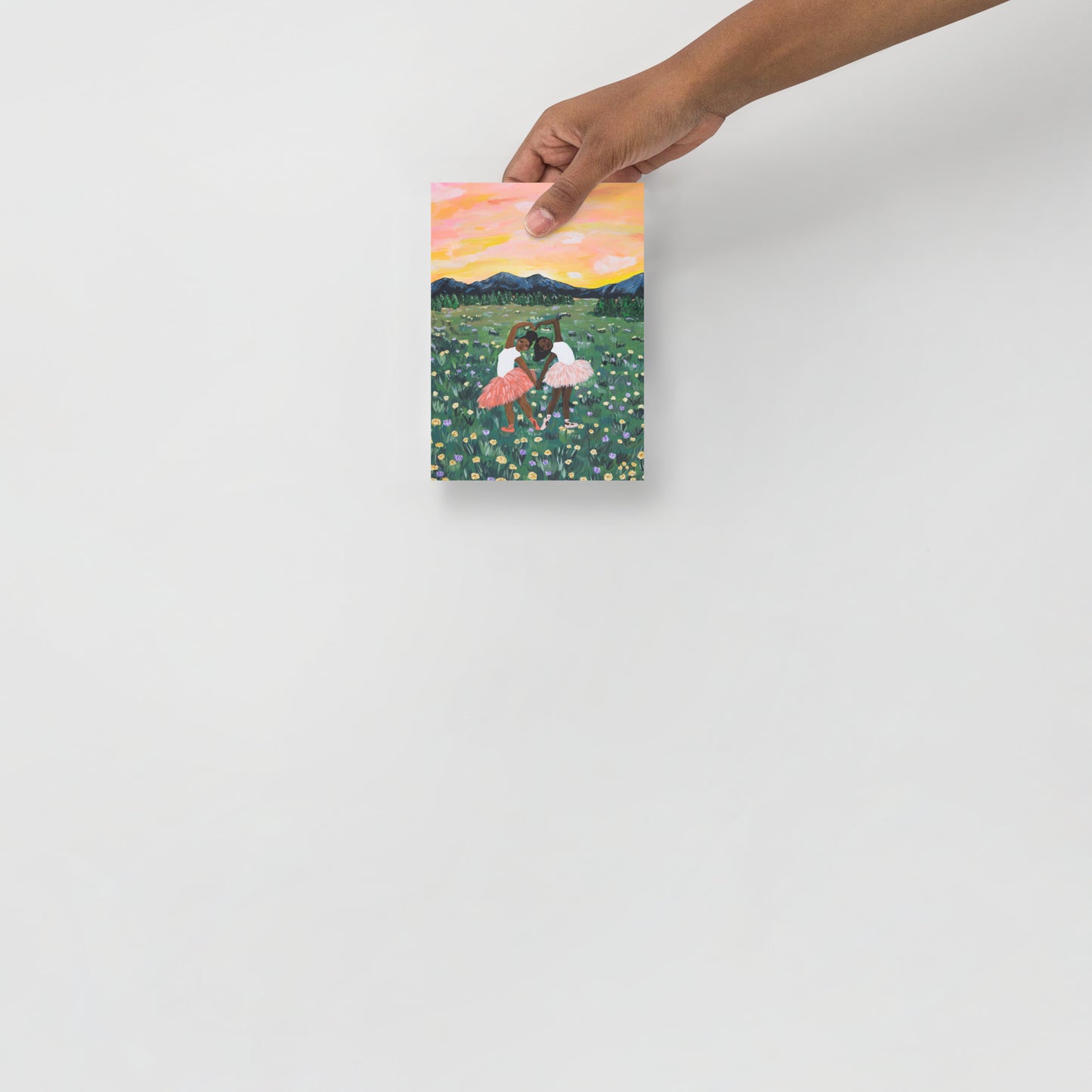 5x7 handheld art print of two ballerinas in a flower field with a colorful sky.