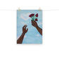 Art print of two hands holding wilting flowers towards the sky.