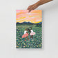 12x18 handheld art print of two ballerinas in a flower field with a colorful sky.